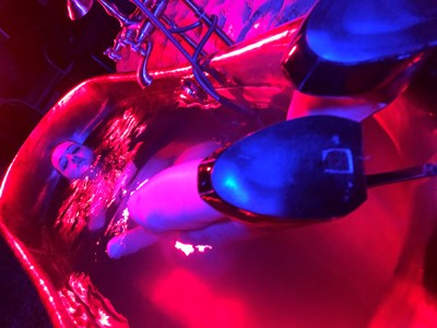 Mistress Vivienne lAmour in the bath with skyscraper heels on copper bath